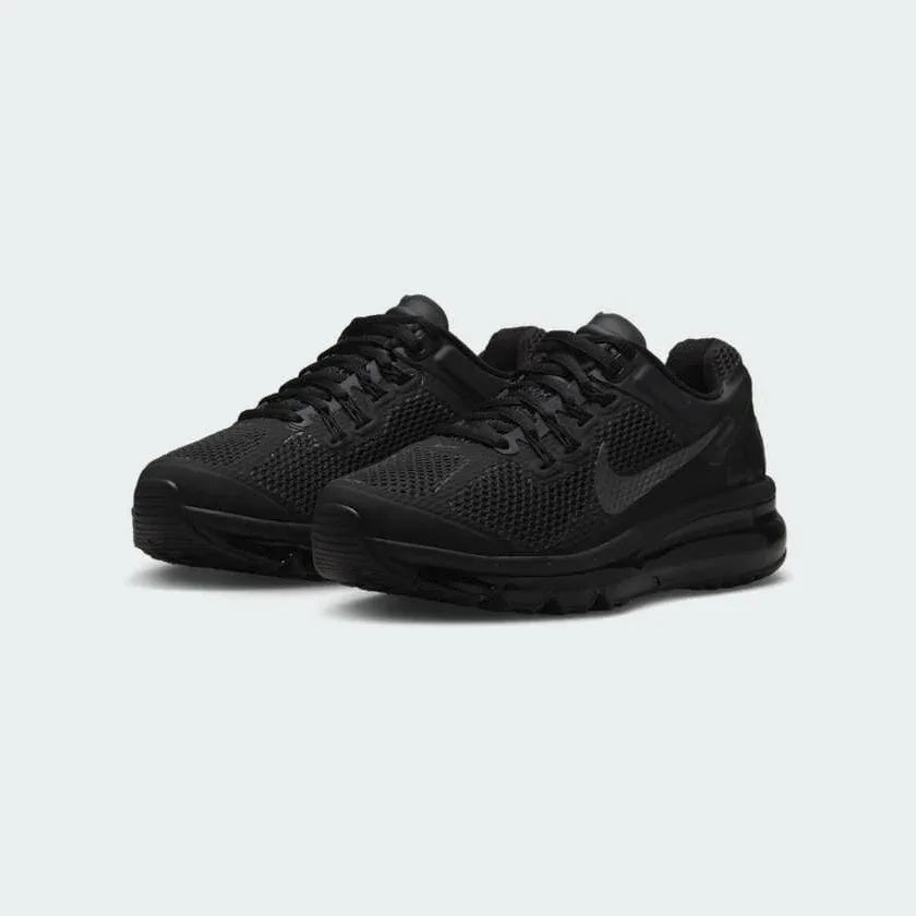 Angled view of two Nike Air Max 2013 Juniors' all-black trainers, side by side, showcasing their iconic design and cushioned profile.