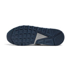 Bottom profile of the shoe displaying the solid navy blue Waffle rubber outsole tread pattern and silver-accented midfoot arch bridge.