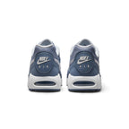 Rear view of the sneakers emphasizing the circular heel badges featuring Nike Air branding, white midsoles, and visible Air-Sole windows.
