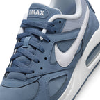 Macro focus on the forefoot and eyestay, detailing the airy mesh toe box, embroidered AIRMAX tongue label, and white side Swoosh.