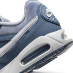 Macro view of the lateral heel transition, highlighting the sculpted white foam midsole, multi-angle Air-Sole window, and Waffle tread grip.
