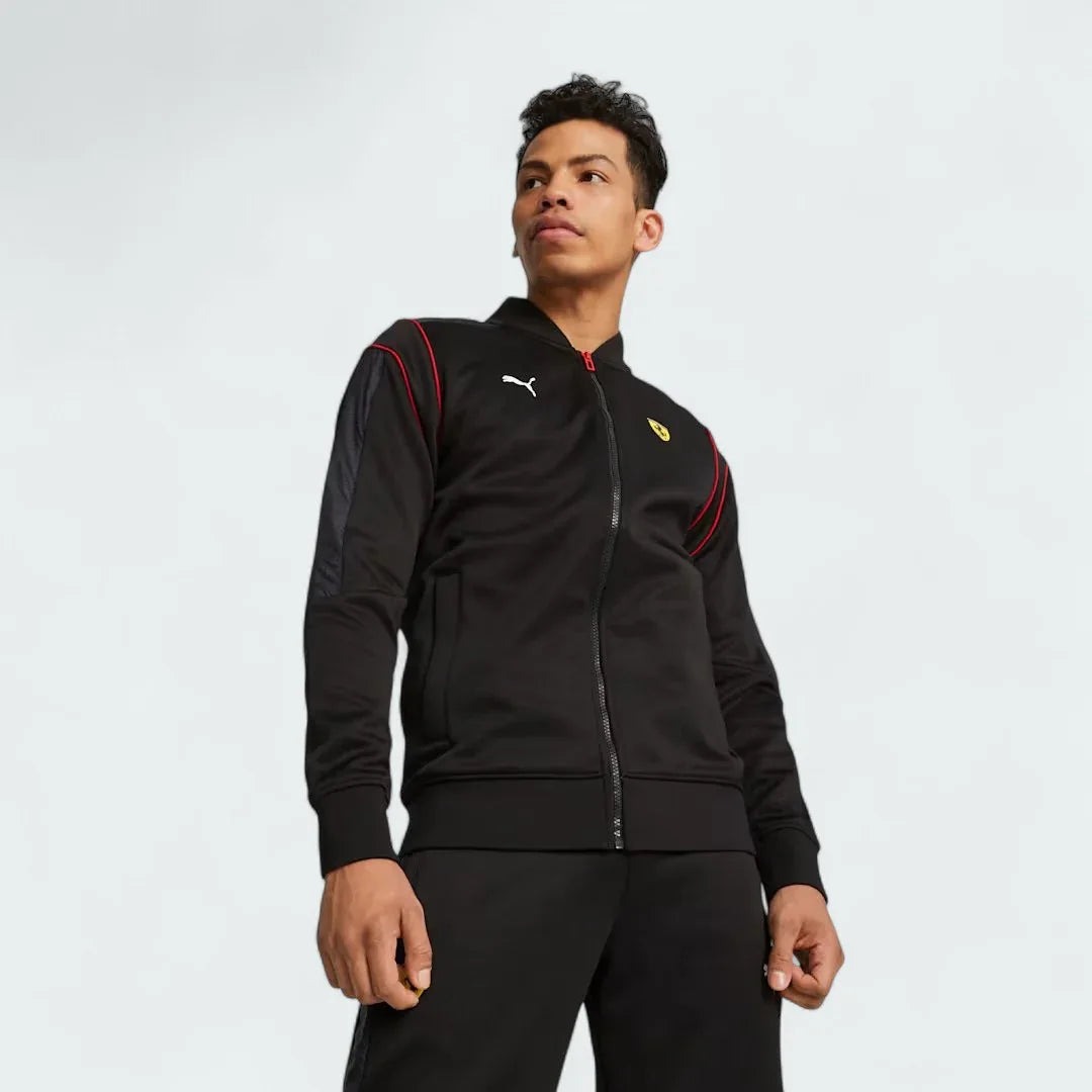Puma x Ferrari Race MT7 Track Jacket Men's in black, worn by model front view showing full-zip closure, stand-up collar, and embroidered Ferrari and Puma logos. Main image