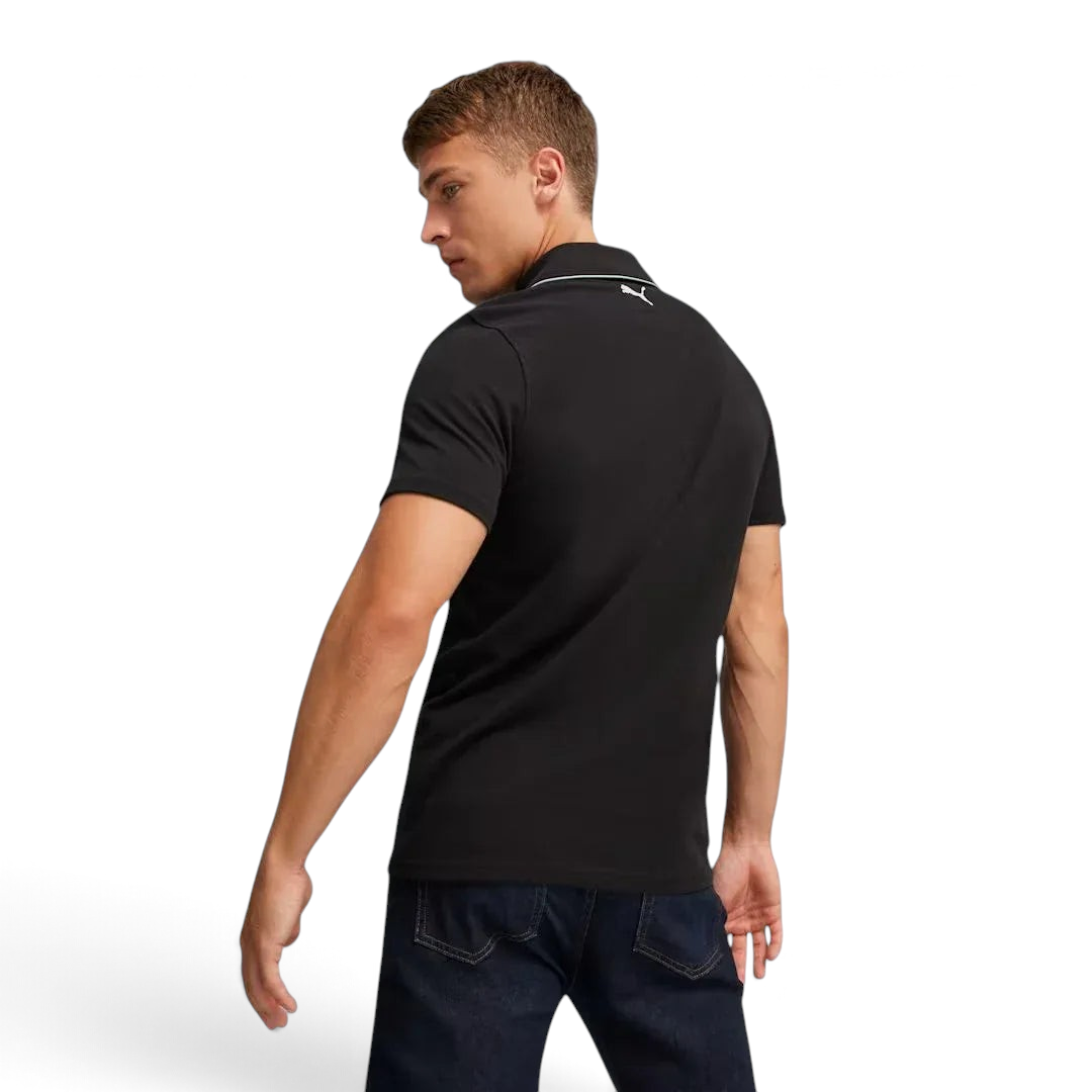 Trade Sports Puma x Ferrari black piqué polo shirt viewed from the back on a male model wearing dark denim jeans