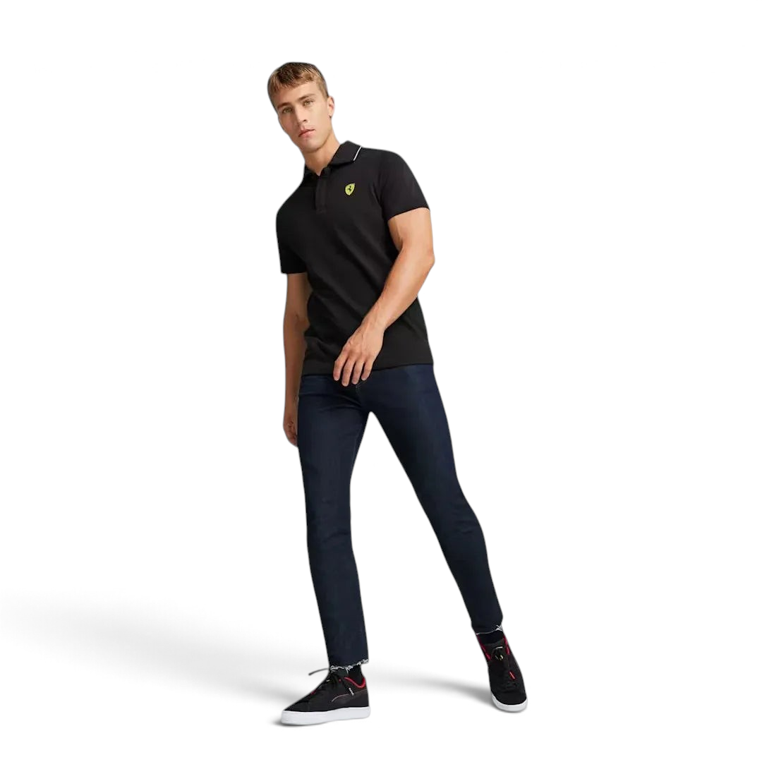 Trade Sports model wearing a black Puma x Ferrari piqué polo shirt with Scudetto badge and two-button placket