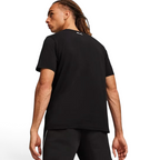Puma x Ferrari Race Big Shield T-Shirt Men's in black, back view on a model showcasing the clean design and classic silhouette.