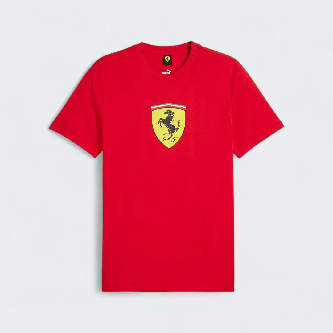 Alt Text: Puma x Ferrari Race Big Shield T-Shirt Men's in red, laydown front view showing a classic crew neck and a large, bold Ferrari Scudetto badge on the chest.
