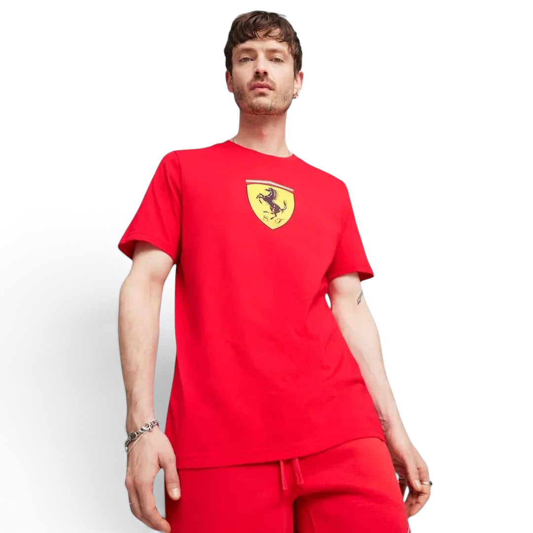 Puma x Ferrari Race Big Shield T-Shirt Men's in red, front view model showing a classic crew neck and a large, bold Ferrari Scudetto badge on the chest. Main image