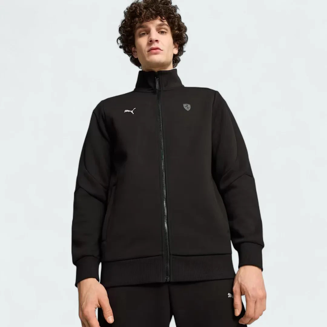 Puma x Ferrari Style MT7 Jacket Men's in black, worn by a model front view showing full-zip closure, stand-up collar, and embroidered Ferrari and Puma logos. Main image