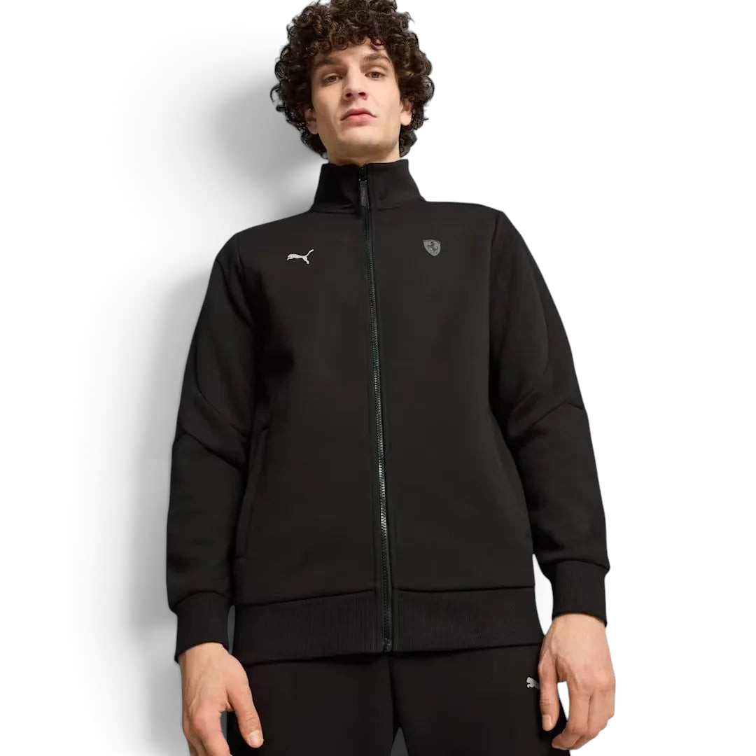 Puma x Ferrari Style MT7 Jacket Men's in black, worn by a model front view showing full-zip closure, stand-up collar, and embroidered Ferrari and Puma logos.