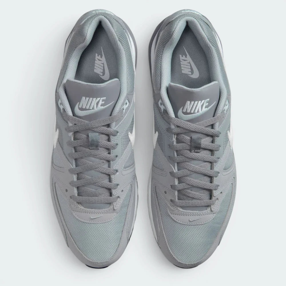 Focuses on the locked-in traditional lacing layout, displaying the perfect symmetry of the wolf grey mesh tongue, matching laces, and the airy open mesh guarding the front toe box area.