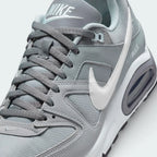 Details the premium precision of the stitched overlays wrapping the front toe cap to defend against debris, showcasing the breathable mesh ventilation pores up close.