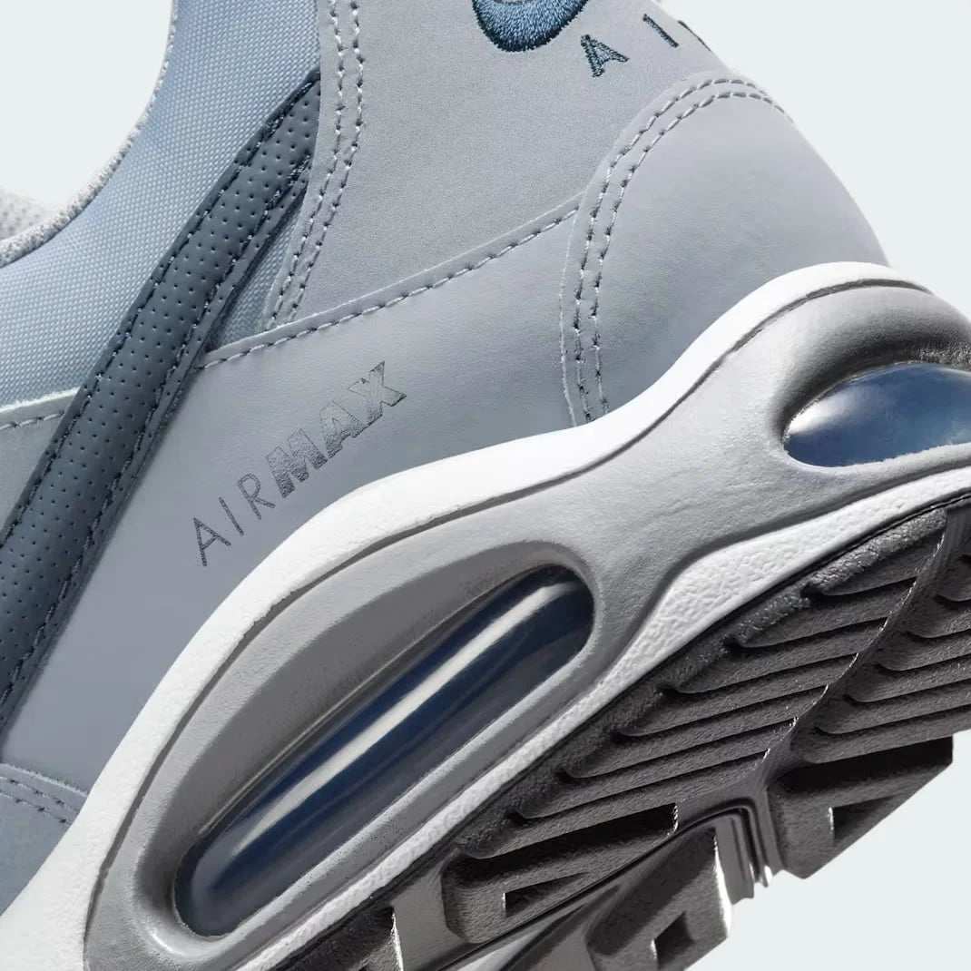 Detailed zoom on the outsole and midsole of the Nike Air Max Command Men's grey trainers, highlighting the cushioned foam and durable rubber outsole.