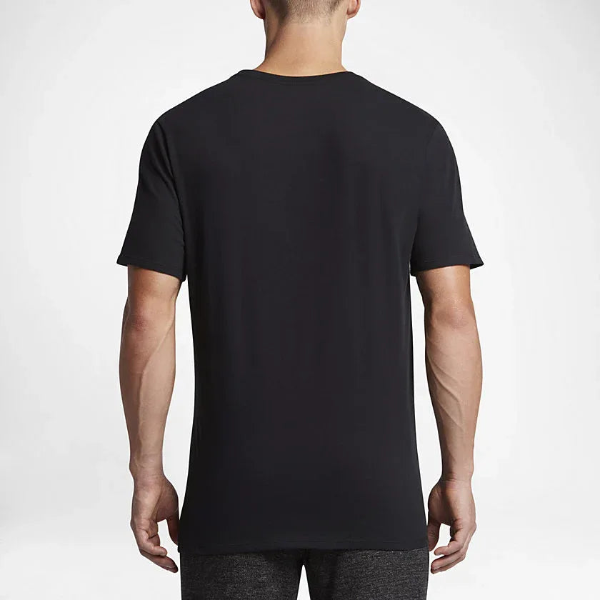 Nike Men's Futura Icon Tee Shirt in black, back view showing the plain design and the fabric texture.