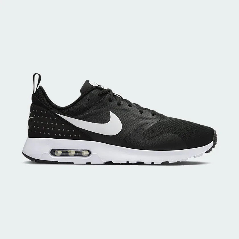 Nike Air Max Tavas Men's trainers in black, side profile showing mesh upper, visible Max Air unit in the heel, and sleek silhouette. Main image