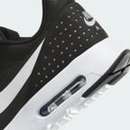 Detailed zoom on the outsole and midsole of the Nike Air Max Tavas Men's black trainers, highlighting the cushioned foam and durable rubber outsole.