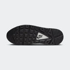 View of the outsole of the Nike Air Max Command Premium Women's black leather trainers, showing the durable rubber tread pattern for reliable traction.