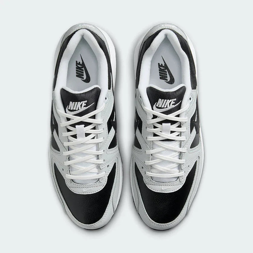 Top-down view of a pair of Nike Air Max Command Premium Women's trainers in black, highlighting their classic silhouette and lace-up closure.