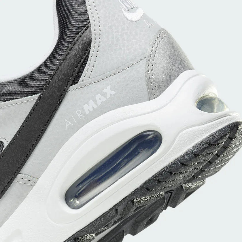 Detailed zoom on the outsole and midsole of the Nike Air Max Command Premium Women's black leather trainers, highlighting the cushioned foam and durable rubber outsole.
