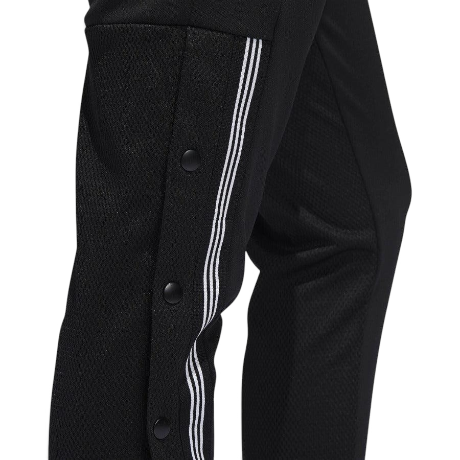 Close-up zoom on the Adidas 7/8 Cropped Snap Pants Women's in black, showing the individual snap buttons along the side and the texture of the knit fabric.