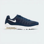 Highlights the high-velocity sweep of the clean white Nike Swoosh, showing the professional sublimated gradient lines across the navy mesh and the clear depth of the heel Air window.