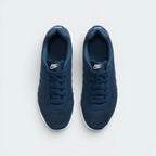 Focuses on the locked-in lace-up fastening layout, displaying the perfect symmetry of the padded navy mesh tongue and the seamless reinforcement skins guarding the front box.