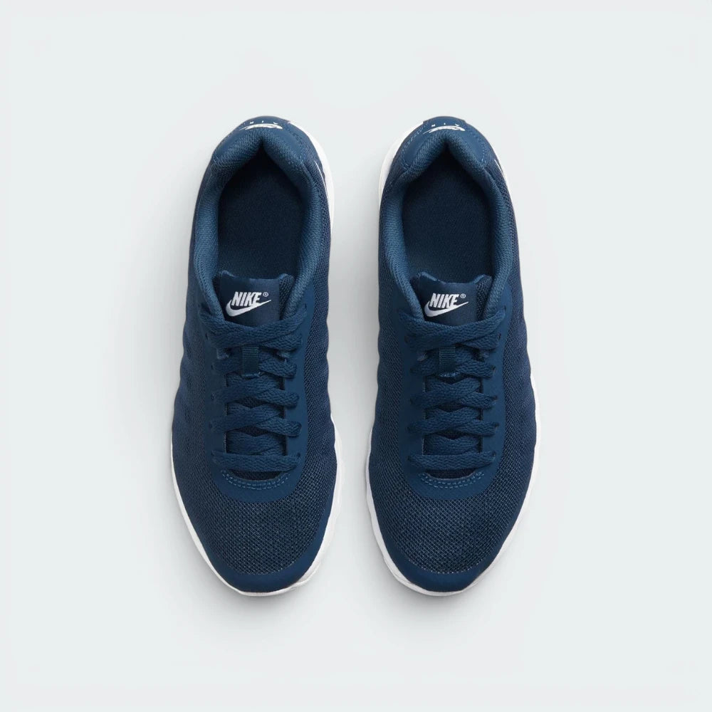 Focuses on the locked-in lace-up fastening layout, displaying the perfect symmetry of the padded navy mesh tongue and the seamless reinforcement skins guarding the front box.
