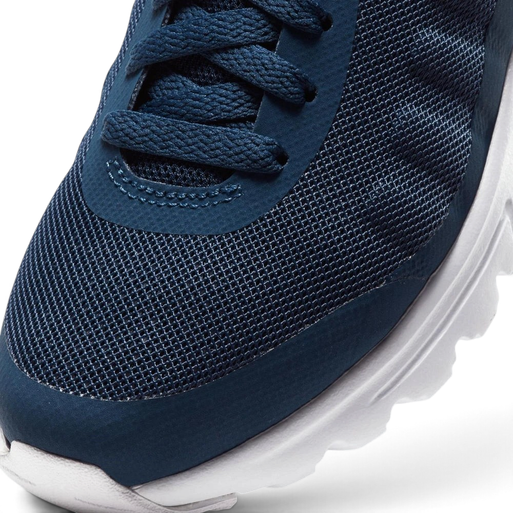Details the premium seamless overlays wrapping the front toe scuff zone and the precision layout of the lacing eyelets.