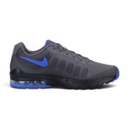 Highlights the lateral profile featuring the dynamic black-to-grey gradient mesh upper, striking Sapphire purple Nike Swoosh on the heel panel, black foam midsole, visible heel Max Air unit, and black rubber outsole.