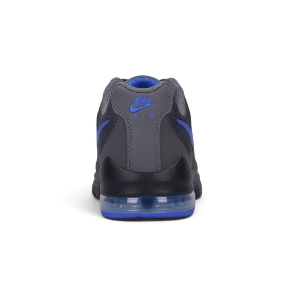 Focuses on the rear profile, highlighting the structured black heel counter, Sapphire purple Nike Air logo badge, and the solid base of the foam midsole enclosing the Air chamber.
