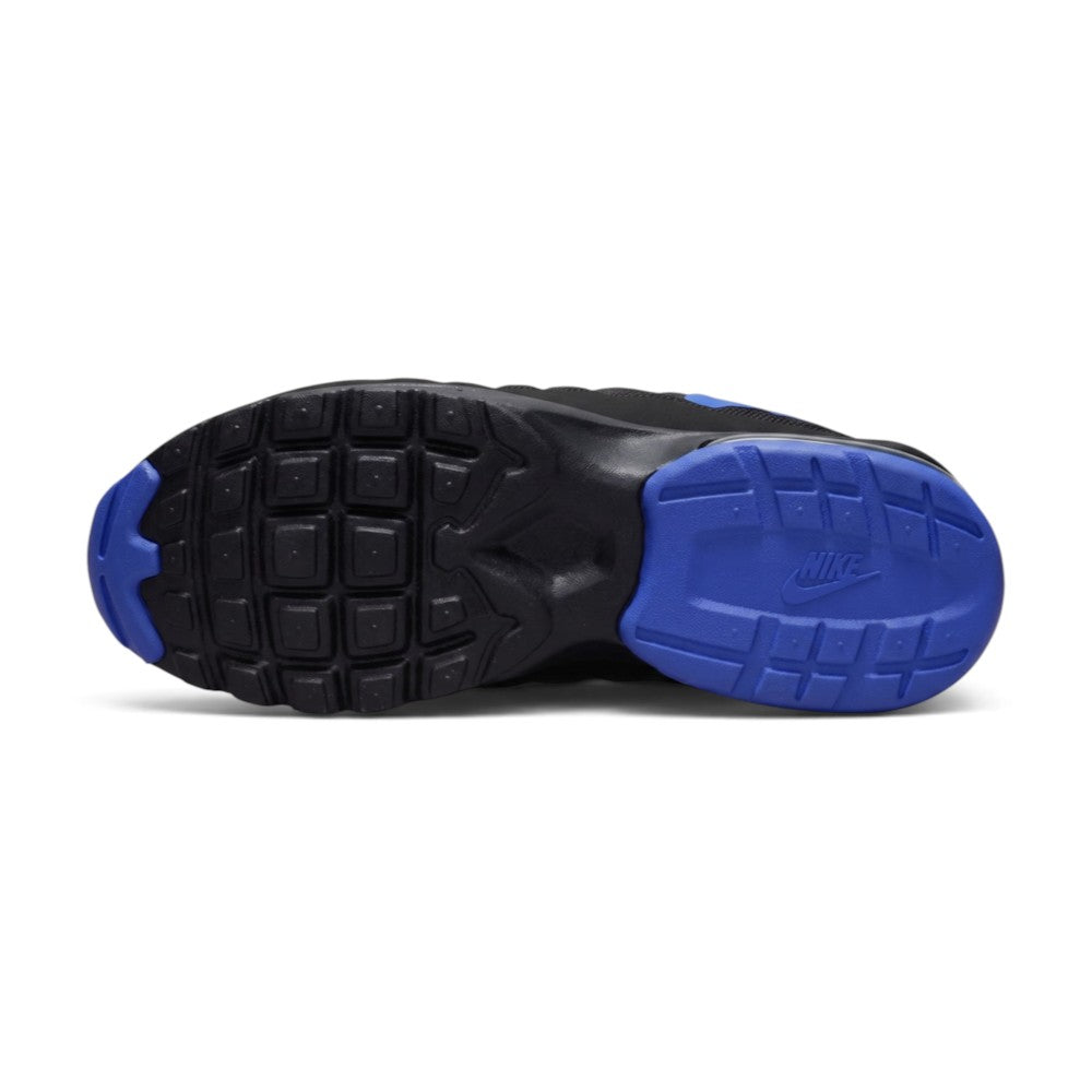 Displays the full-length black rubber sole, showcasing the classic waffle lug pattern, forefoot flex grooves, and debossed Nike branding.