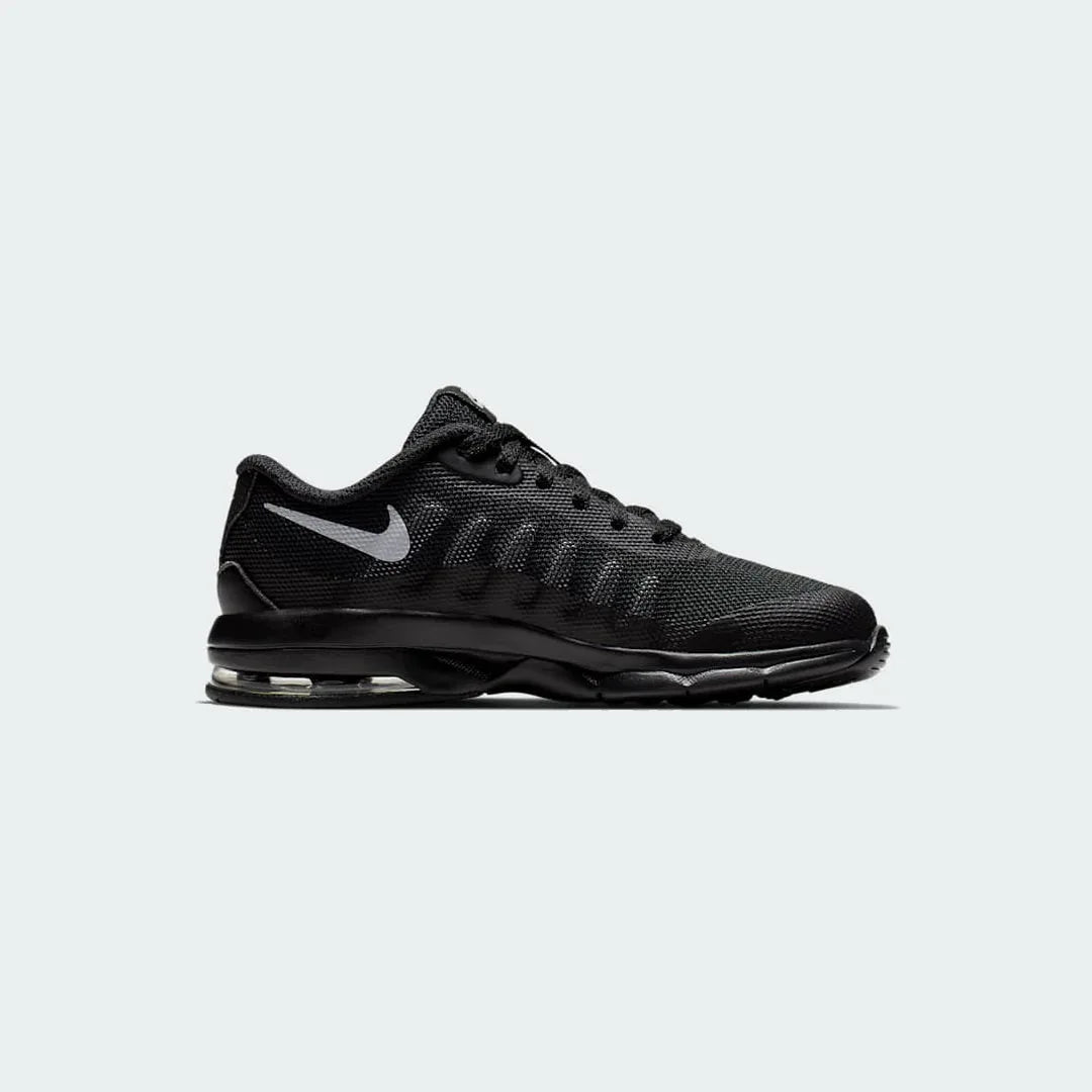 Nike Air Max Invigor Children's trainers in black with grey accents, side profile showing mesh upper, prominent visible Max Air unit in the heel, and sleek silhouette. Main image