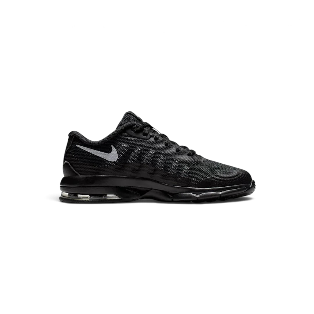 Nike Air Max Invigor Children's trainers in black with grey accents, side profile showing mesh upper, prominent visible Max Air unit in the heel, and sleek silhouette.