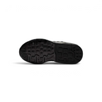 View of the outsole of the Nike Air Max Invigor Children's black trainers, showing the durable rubber tread pattern.