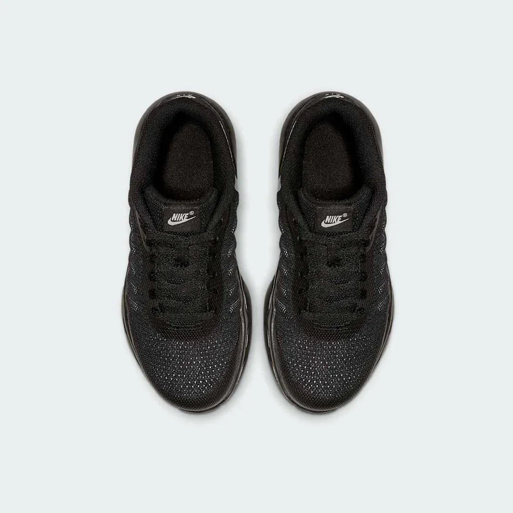 Top-down view of a pair of Nike Air Max Invigor Children's trainers in black, highlighting their streamlined design and lace-up closure.