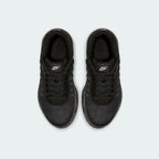 Top-down view of a pair of Nike Air Max Invigor Children's trainers in black, highlighting their streamlined design and lace-up closure.