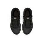 Top-down view of a pair of Nike Air Max Invigor Children's trainers in black, highlighting their streamlined design and lace-up closure.