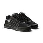Black athletic shoes with Nike logo on a light gray background