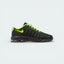 Side profile of the Nike Air Max Invigor in Black, showing the Breathe Tech mesh panels and the vibrant Volt Yellow visible Air unit in the heel.