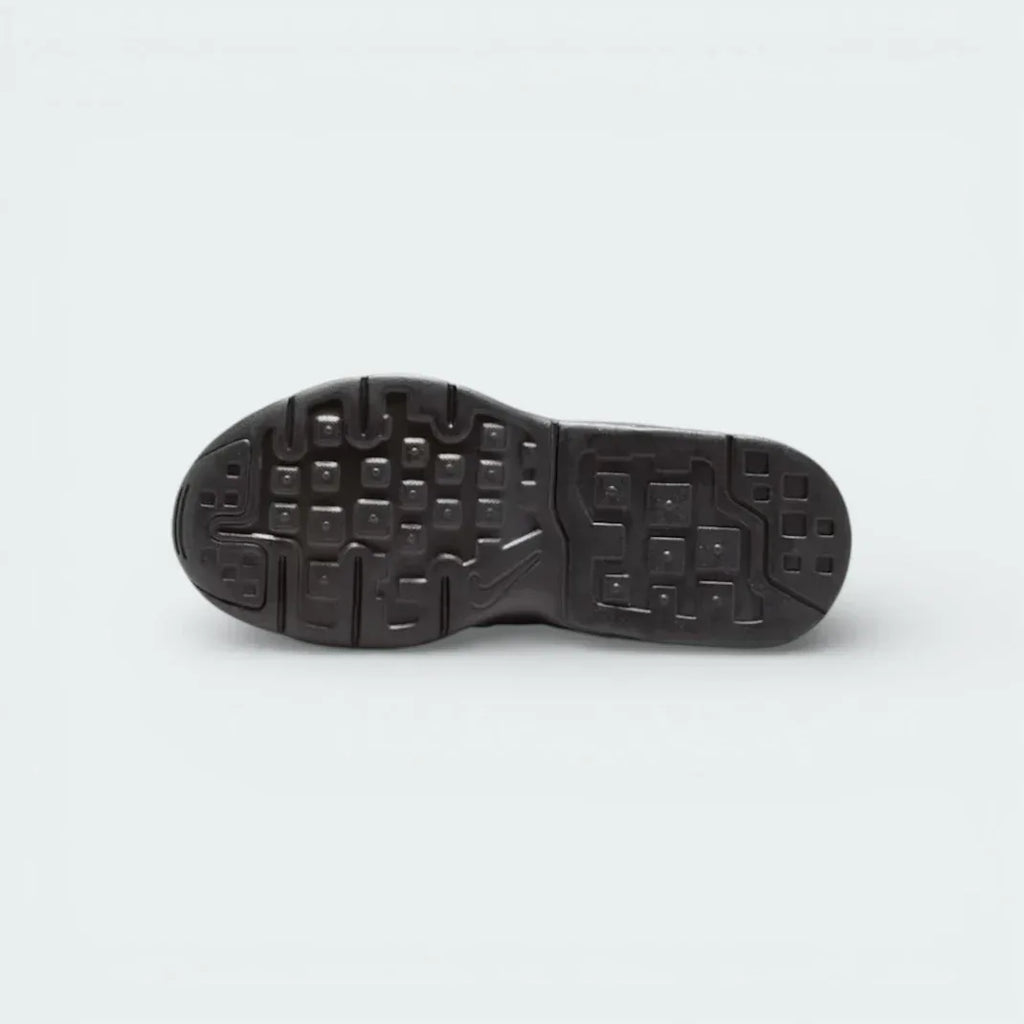View of the black rubber outsole, showcasing the modified waffle traction pattern for multi-surface grip.