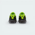 Rear view focusing on the heel support and the neon yellow accents within the Max Air cushioning window.