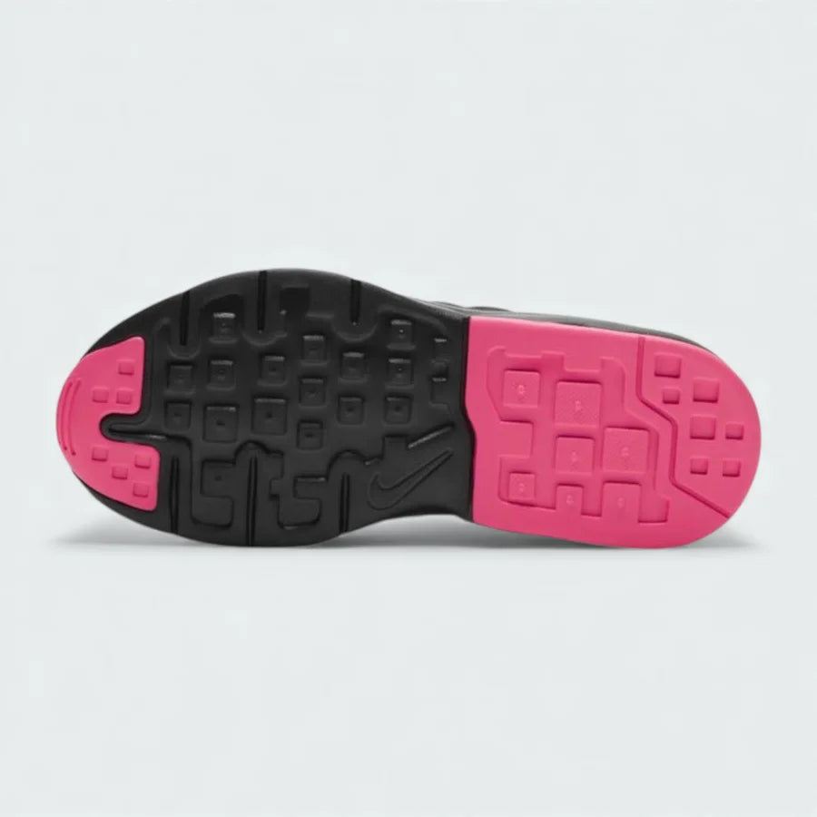 View of the outsole of the Nike Air Max Invigor Children's black trainers, showing the durable rubber tread pattern.