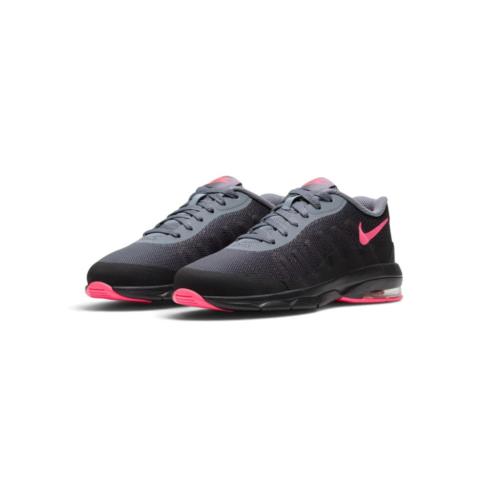 Three-quarter forward angle of the Nike Air Max Invigor children's trainers, showcasing their retro running aesthetic and vibrant pink-and-black color blocking.