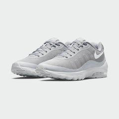 Angled view of two Nike Air Max Invigor Men's grey trainers, side by side, showcasing their modern aesthetic and lightweight construction.