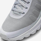Close-up zoom on the front of the Nike Air Max Invigor Men's grey trainers, showing the mesh toe box, lacing system, and synthetic overlays.