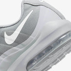 Detailed zoom on the outsole and midsole of the Nike Air Max Invigor Men's grey trainers, highlighting the cushioned foam and visible Max Air unit.