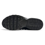 Focusing on the durable full-length rubber outsole featuring a generative traction pattern with specialized uphill and downhill lugs, showcasing the road grip matrix engineered for a successful tackle of wet tarmac, concrete pavements, and treadmill belts.