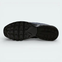 View of the black rubber outsole, showcasing the waffle-inspired traction pattern for multi-surface grip.