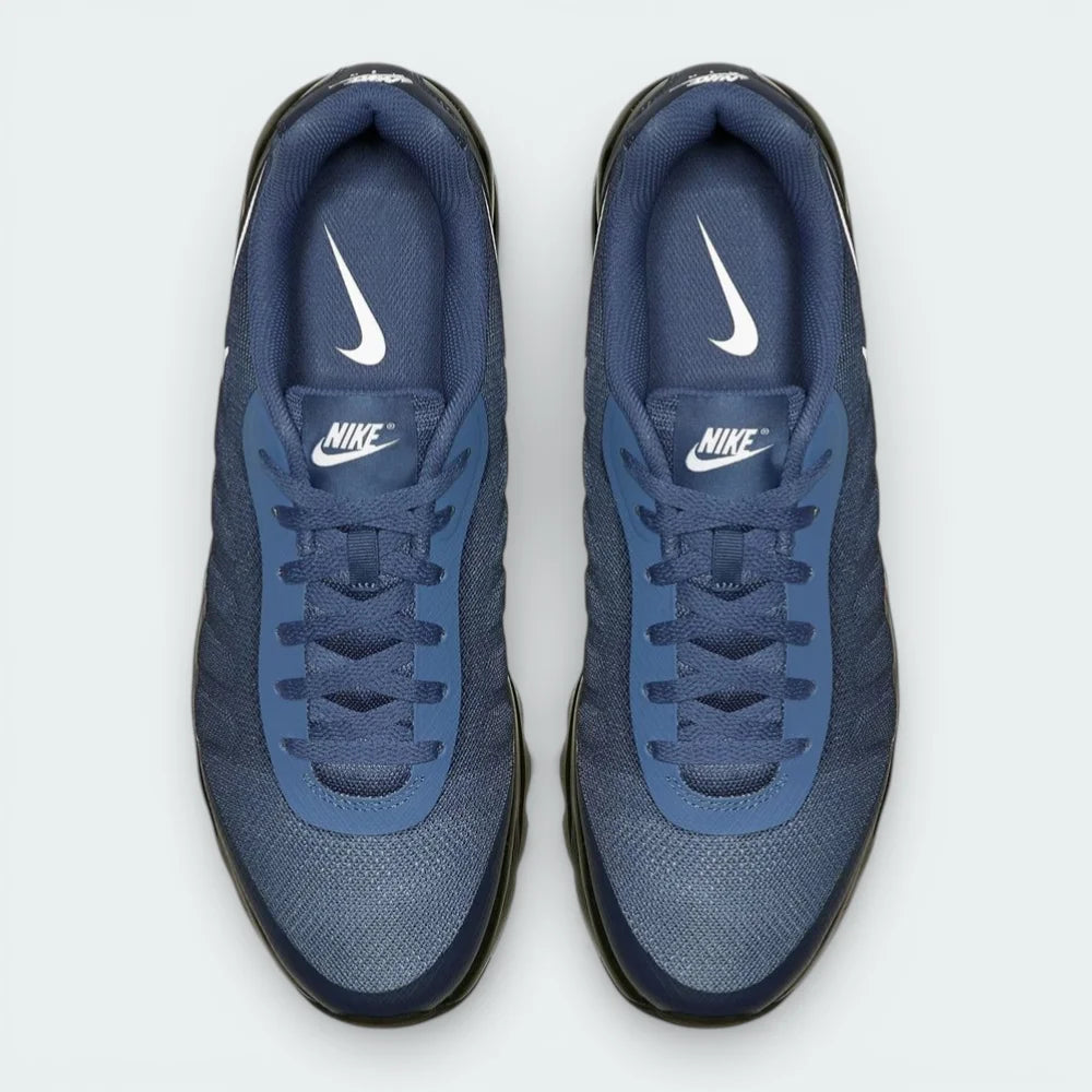 Top-down view of the Thunder Blue trainers, highlighting the breathable mesh upper and the Solar Red Nike Air branding on the tongue.