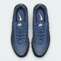 Top-down view of the Thunder Blue trainers, highlighting the breathable mesh upper and the Solar Red Nike Air branding on the tongue.