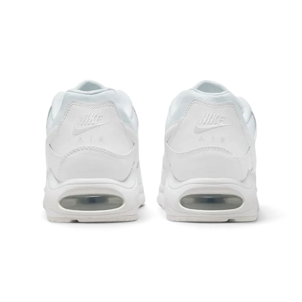 Close-up rear angle focusing on the supportive white leather heel panels with embroidered "NIKE AIR" branding, the curved white midsole wrap, and the rear Max Air window.